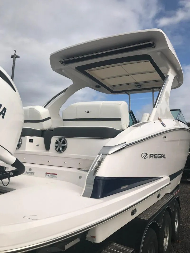 Slide: The Image of 2017 Regal 29 OBX boat with Yamaha outboard motor, sleek design, and spacious deck. - 10