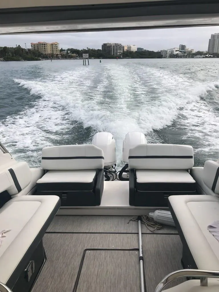 Slide: The Image of 2017 Regal 29 OBX boat cruising on open water, view from the deck. - 6