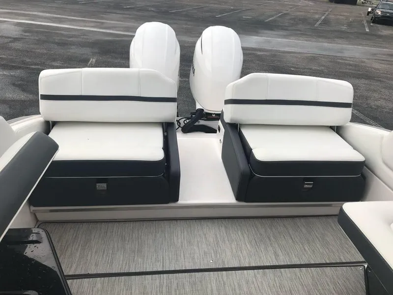 Slide: The Image of 2017 Regal 29 OBX boat interior with dual seating and twin engines. - 9