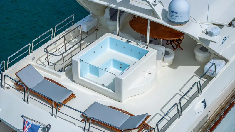 Slide: The Image of Luxurious Azimut 100 Jumbo yacht deck with jacuzzi and sun loungers, 2000 model. - 26