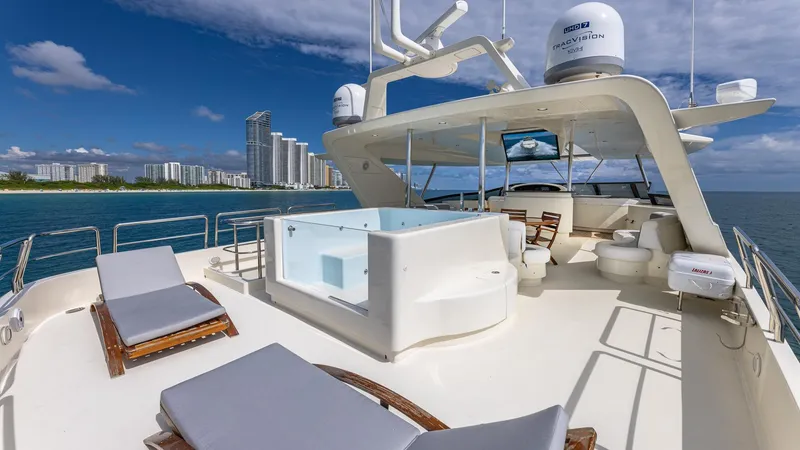 Slide: The Image of Luxurious Azimut 100 Jumbo yacht deck with jacuzzi, sun loungers, and ocean view. - 29