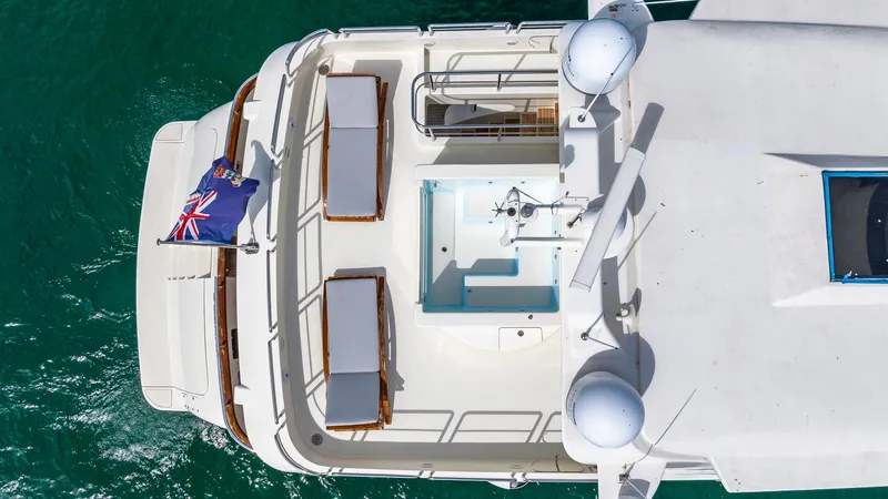 Slide: The Image of Overhead view of 2000 Azimut 100 Jumbo yacht deck with flag and seating. - 30