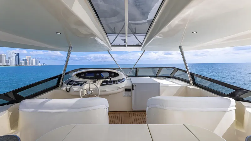 Slide: The Image of Helm of 2000 Azimut 100 Jumbo yacht with ocean view and city skyline. - 32