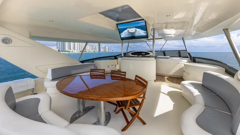Slide: The Image of Luxurious 2000 Azimut 100 Jumbo yacht interior with elegant seating and ocean view. - 37