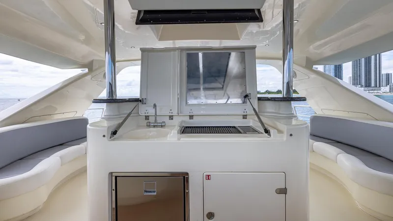 Slide: The Image of Azimut 100 Jumbo 2000 yacht interior with seating and kitchenette, featuring modern design. - 41