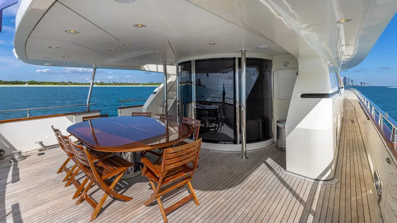 Slide: The Image of Luxury Azimut 100 Jumbo yacht deck with dining area, ocean view, and sleek design, year 2000. - 45