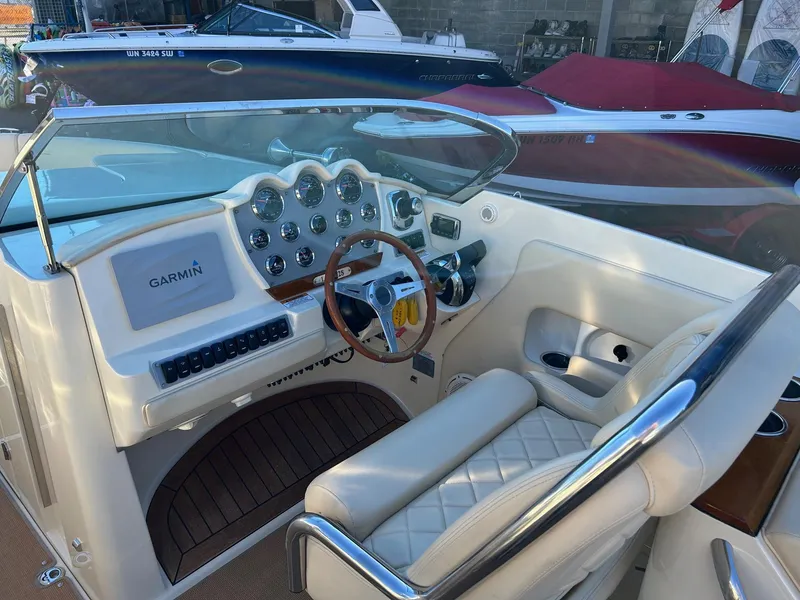 Slide: The Image of 2015 Chris-Craft Launch 28 boat cockpit with Garmin navigation system and luxurious seating. - 10
