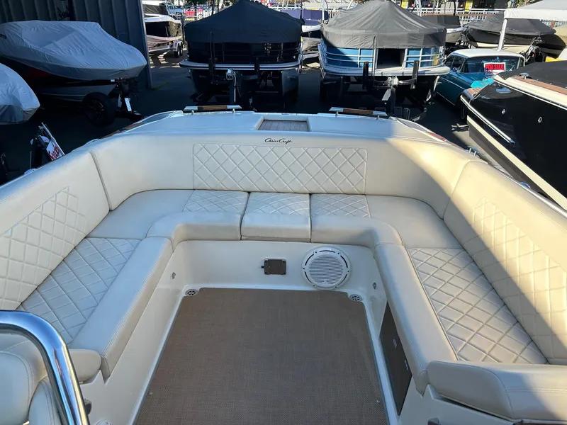 Slide: The Image of 2015 Chris-Craft Launch 28 boat interior with cream leather seating and diamond stitching. - 13