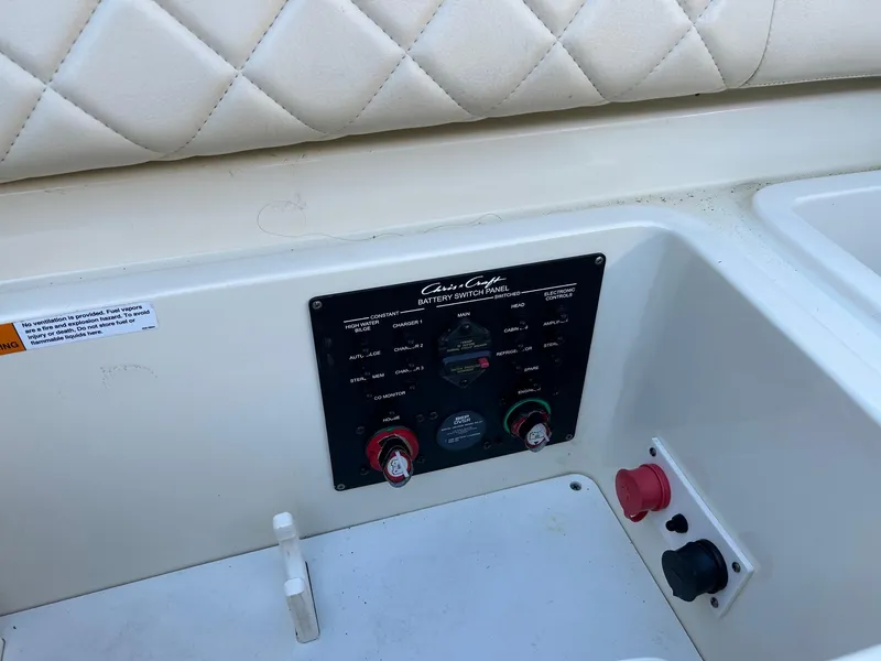 Slide: The Image of Control panel of a 2015 Chris-Craft Launch 28 boat with quilted upholstery. - 20