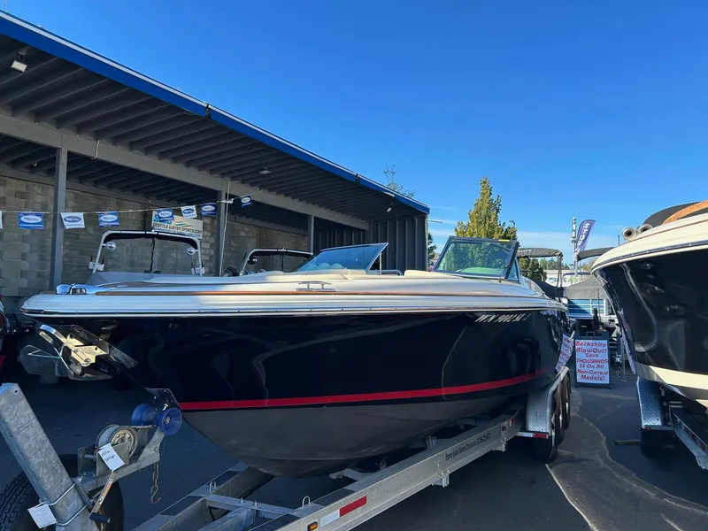 Slide: The Image of 2015 Chris-Craft Launch 28 boat on trailer, displayed outdoors. - 3