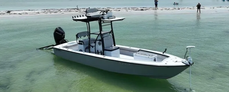 Slide: The Image of 2022 Dorado 25 Flat Deck boat in shallow water near a sandy beach. - 2