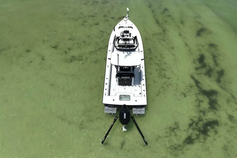 Slide: The Image of Aerial view of 2022 Dorado 25 Flat Deck boat in clear shallow water. - 3