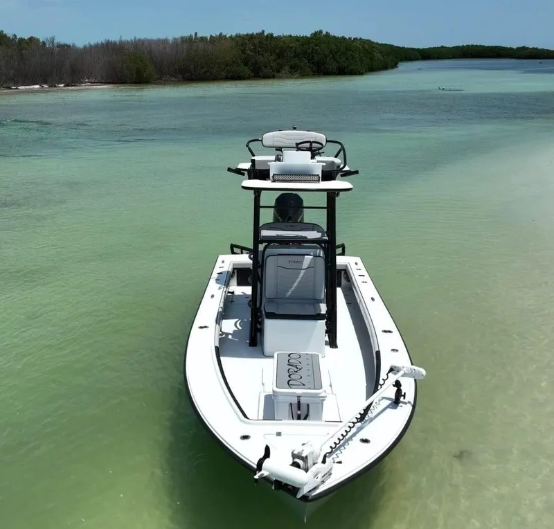 Slide: The Image of 2022 Dorado 25 Flat Deck boat on clear, shallow water near mangroves. - 5