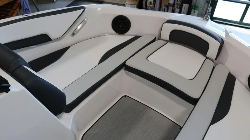 Slide: The Image of 2025 Yamaha Boats AR195 interior seating with sleek black and white design. - 10