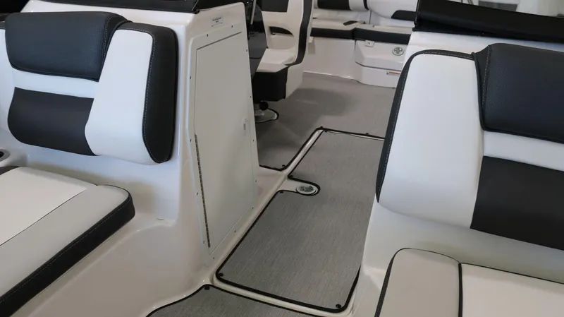 Slide: The Image of 2025 Yamaha AR195 boat interior with sleek black and white seating. - 12