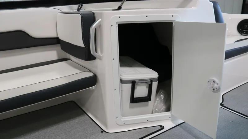 Slide: The Image of 2025 Yamaha AR195 boat interior with open storage compartment and cooler. - 15