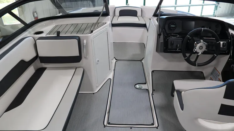 Slide: The Image of 2025 Yamaha Boats AR195 interior with sleek seating and modern dashboard design. - 16