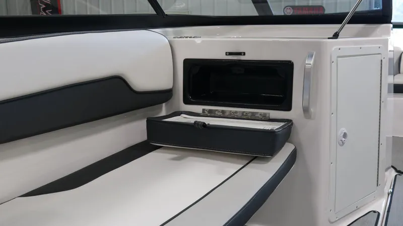 Slide: The Image of Interior of 2025 Yamaha AR195 boat with sleek seating and storage compartment. - 17