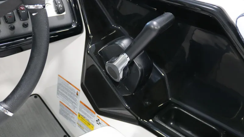 Slide: The Image of 2025 Yamaha AR195 boat throttle and steering wheel close-up. - 21