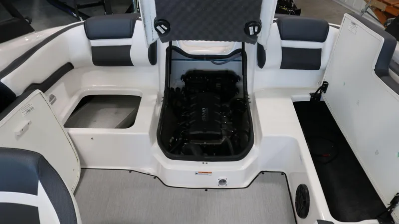 Slide: The Image of 2025 Yamaha AR195 boat interior with open engine compartment. - 23