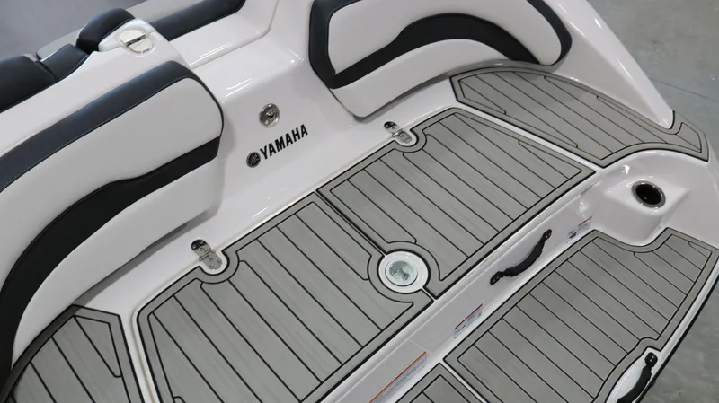 Slide: The Image of 2025 Yamaha AR195 boat interior with sleek seating and non-slip flooring. - 26