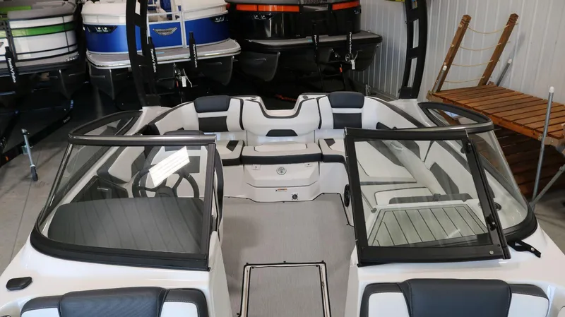 Slide: The Image of 2025 Yamaha Boats AR195 interior view in showroom setting. - 8