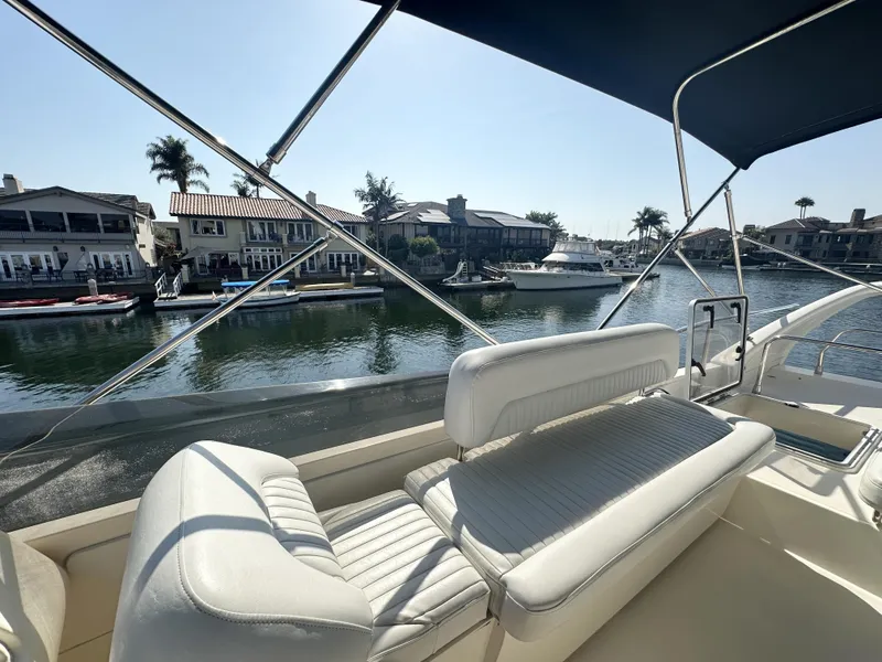 Slide: The Image of 1996 Azimut 54 yacht interior with waterfront view and luxurious seating. - 36