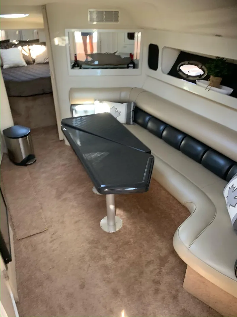 Slide: The Image of Interior of 1996 Wellcraft 45 Excalibur yacht with modern seating and table. - 13