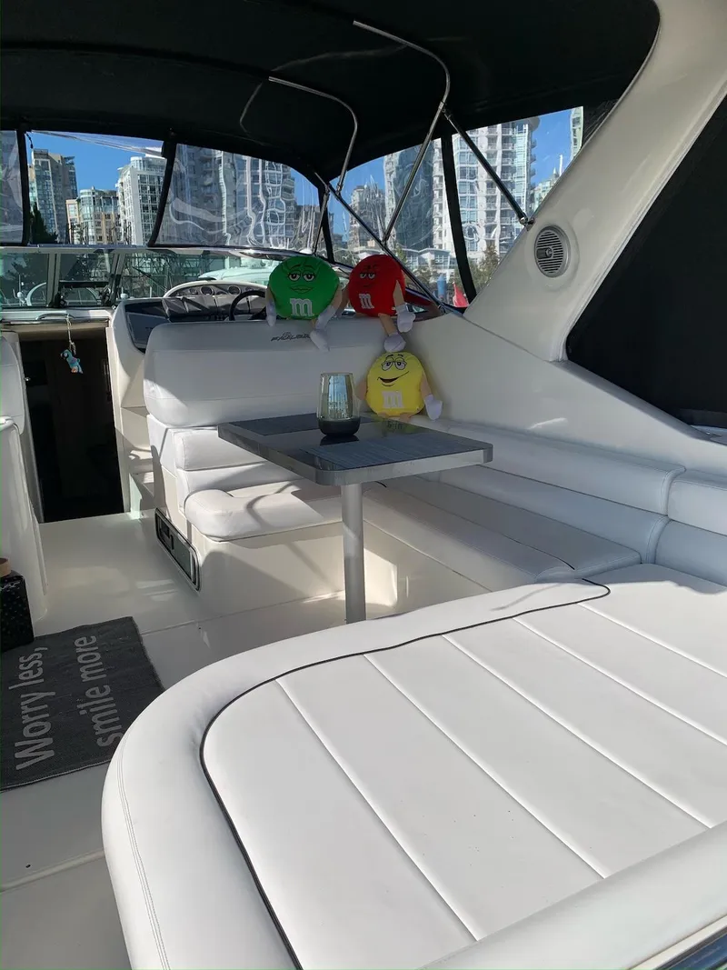 Slide: The Image of 1996 Wellcraft 45 Excalibur interior with plush seating and colorful M&M decorations. - 4