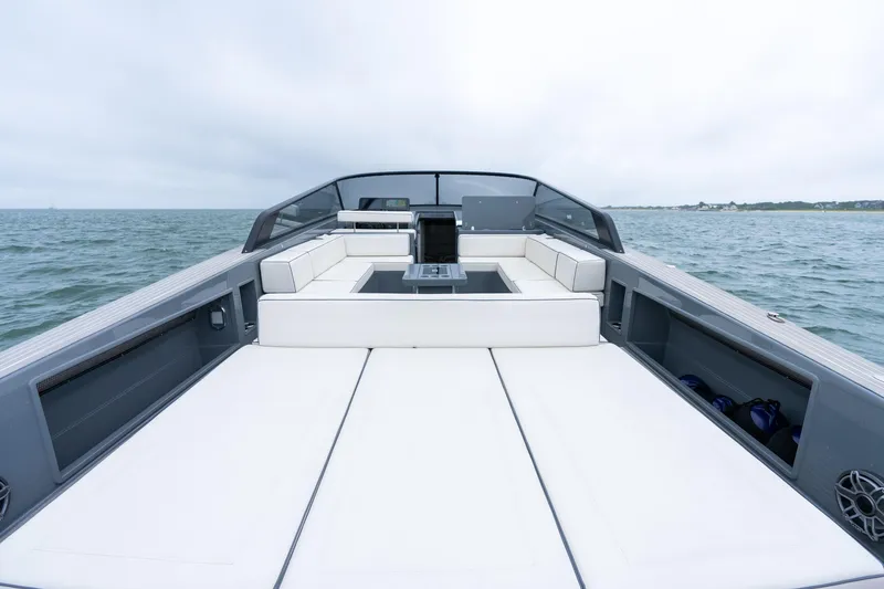 Slide: The Image of 2023 VanDutch 48 yacht with sleek design and spacious deck on open water. - 12