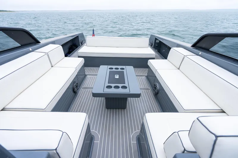 Slide: The Image of Luxurious 2023 VanDutch 48 yacht interior with sleek seating and modern design on open water. - 16