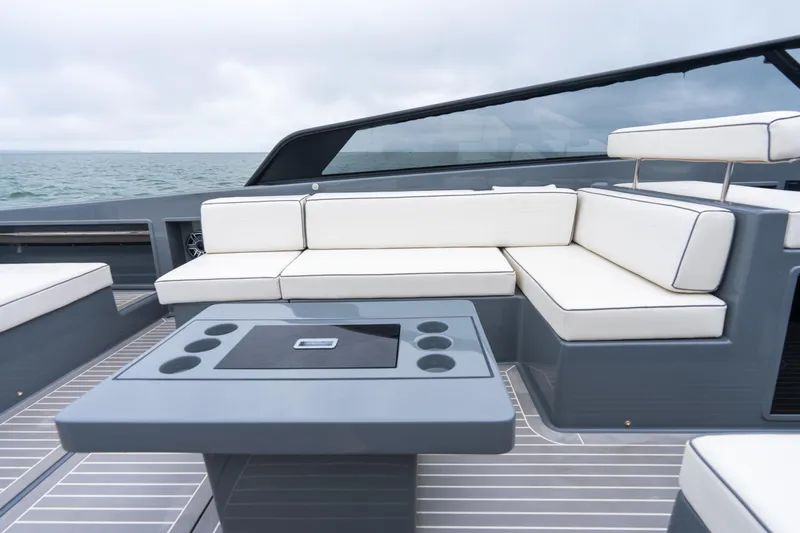 Slide: The Image of Luxurious 2023 VanDutch 48 yacht with sleek seating and modern design on open water. - 17
