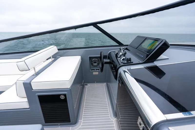 Slide: The Image of 2023 VanDutch 48 yacht cockpit with sleek design and modern navigation system. - 18
