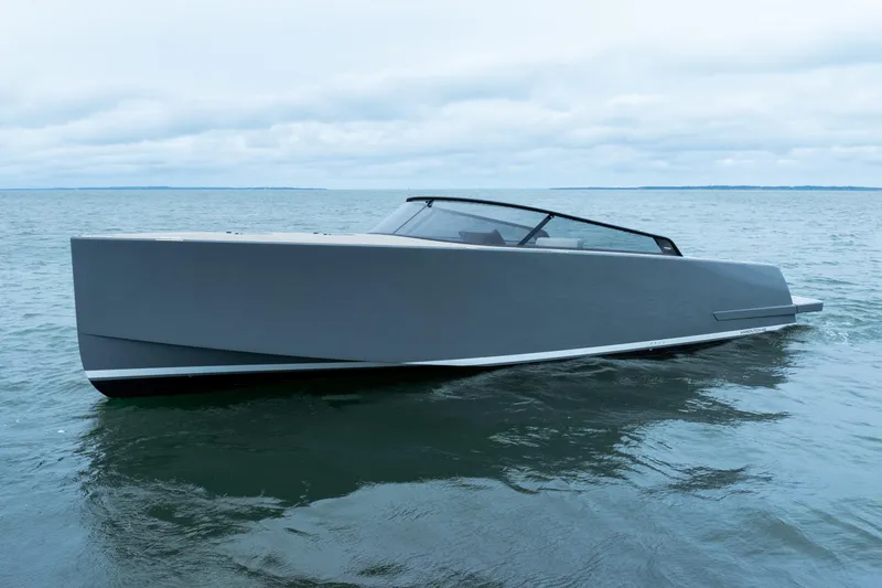 Slide: The Image of 2023 VanDutch 48 yacht on open water, showcasing sleek modern design. - 2