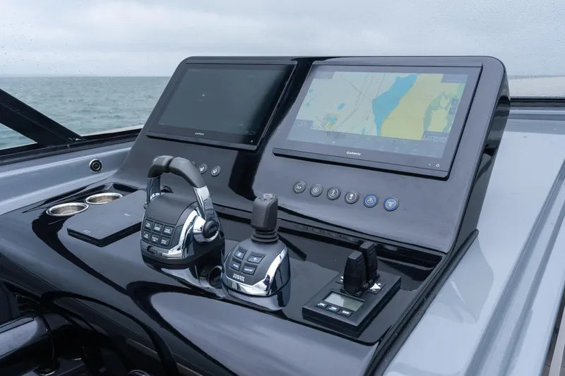 Slide: The Image of Control panel of 2023 VanDutch 48 yacht with navigation screens and controls. - 20