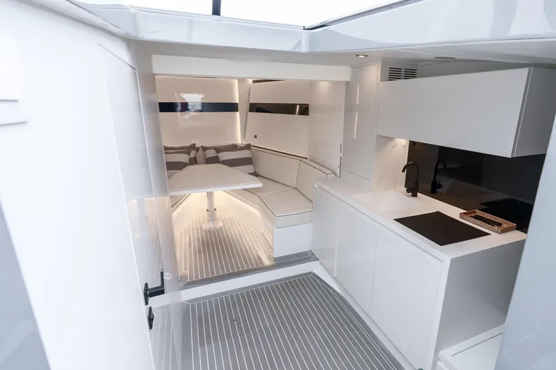 Slide: The Image of Luxurious interior of 2023 VanDutch 48 yacht with modern kitchen and seating area. - 23