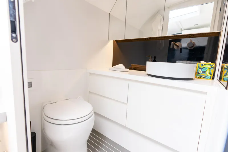 Slide: The Image of Modern bathroom interior on 2023 VanDutch 48 yacht, featuring sleek design and elegant fixtures. - 26