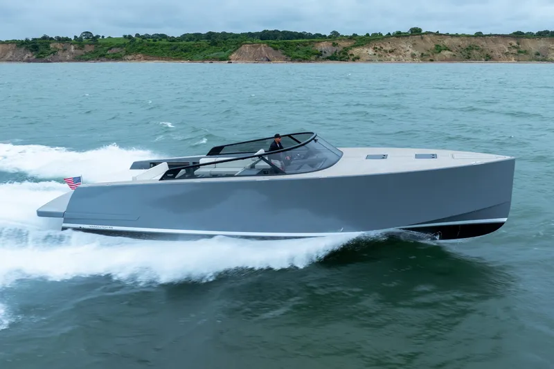 Slide: The Image of 2023 VanDutch 48 yacht cruising on open water, showcasing sleek design and luxury. - 3