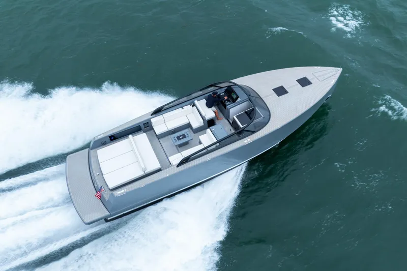 Slide: The Image of 2023 VanDutch 48 yacht cruising on open water, showcasing sleek design and luxury features. - 5