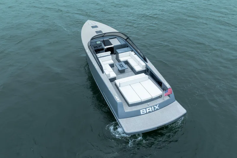 Slide: The Image of 2023 VanDutch 48 luxury yacht cruising on open water, featuring sleek design and spacious deck. - 8