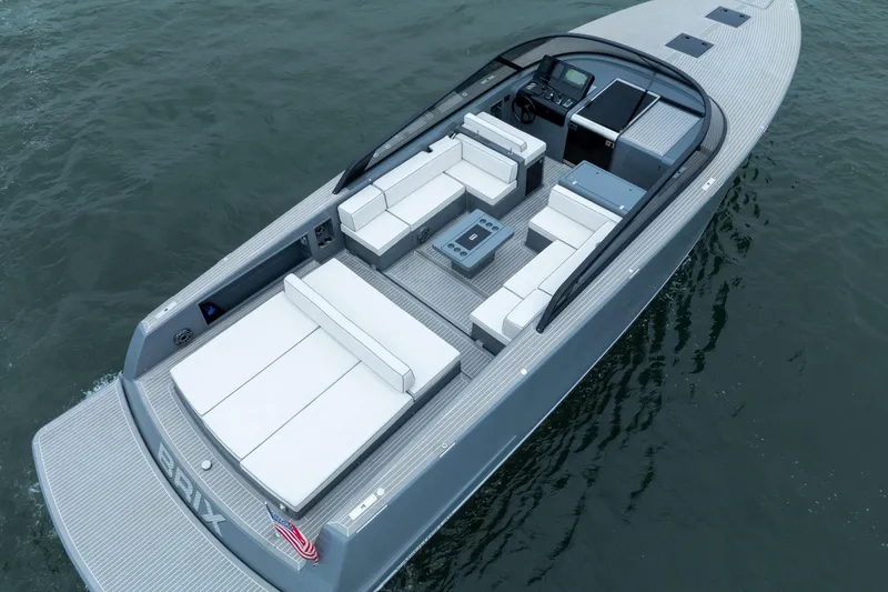 Slide: The Image of 2023 VanDutch 48 luxury yacht with sleek design and spacious seating on open water. - 9