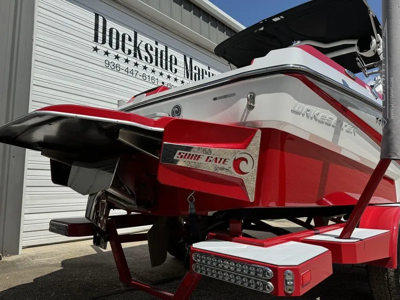 Slide: The Image of 2022 Malibu 21 LX boat at Dockside Marine, featuring red and white design. - 4