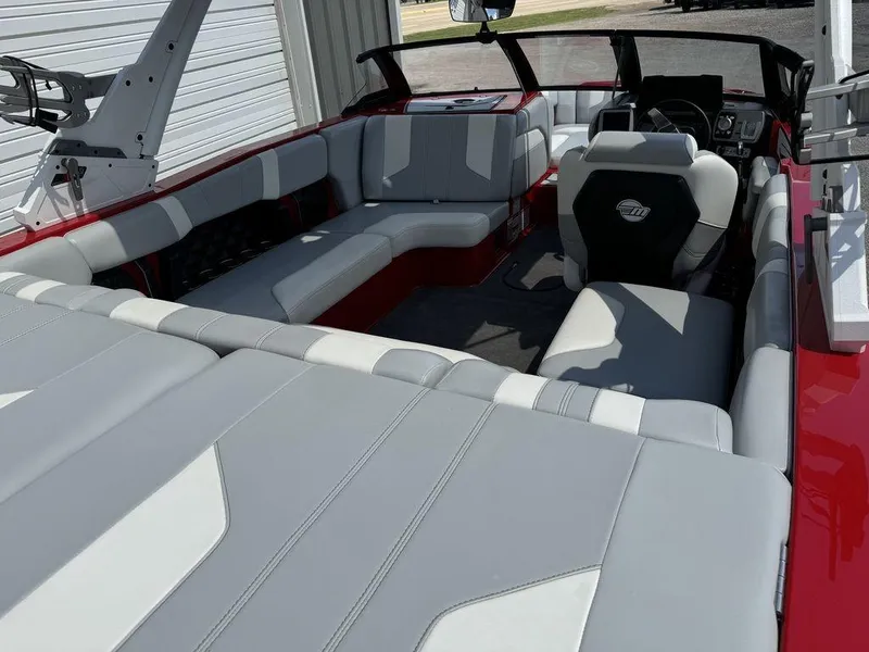 Slide: The Image of Interior of 2022 Malibu 21 LX boat with gray and red seating. - 7