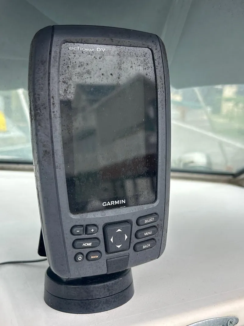 Slide: The Image of Garmin GPS device on 1993 Grady-White 24 Explorer boat dashboard. - 15