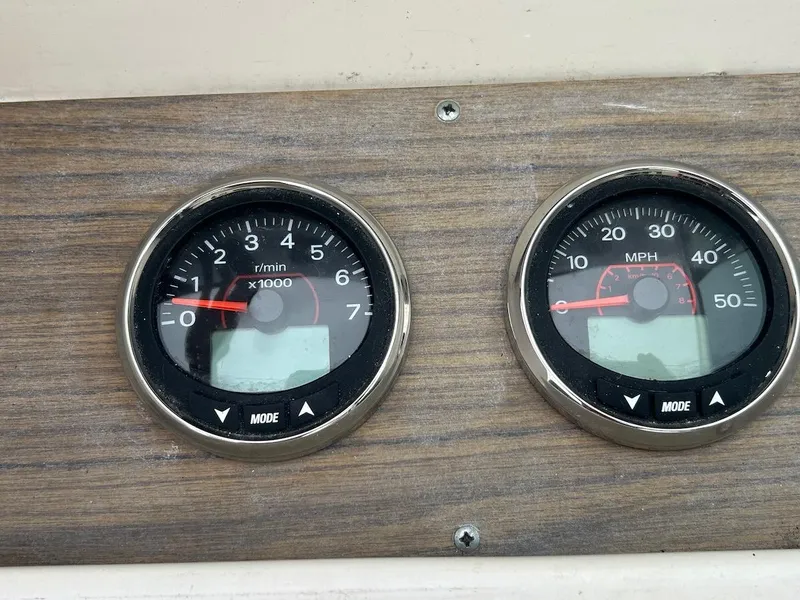 Slide: The Image of Dashboard gauges of a 1993 Grady-White 24 Explorer boat. - 16
