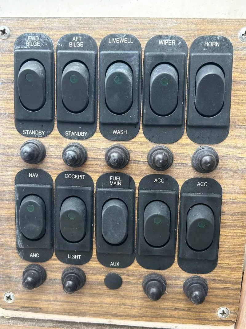 Slide: The Image of Control panel of a 1993 Grady-White 24 Explorer boat with various switches. - 17