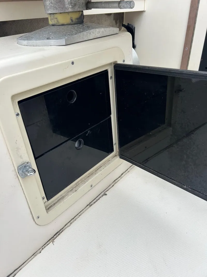 Slide: The Image of Open storage compartment on 1993 Grady-White 24 Explorer boat. - 26