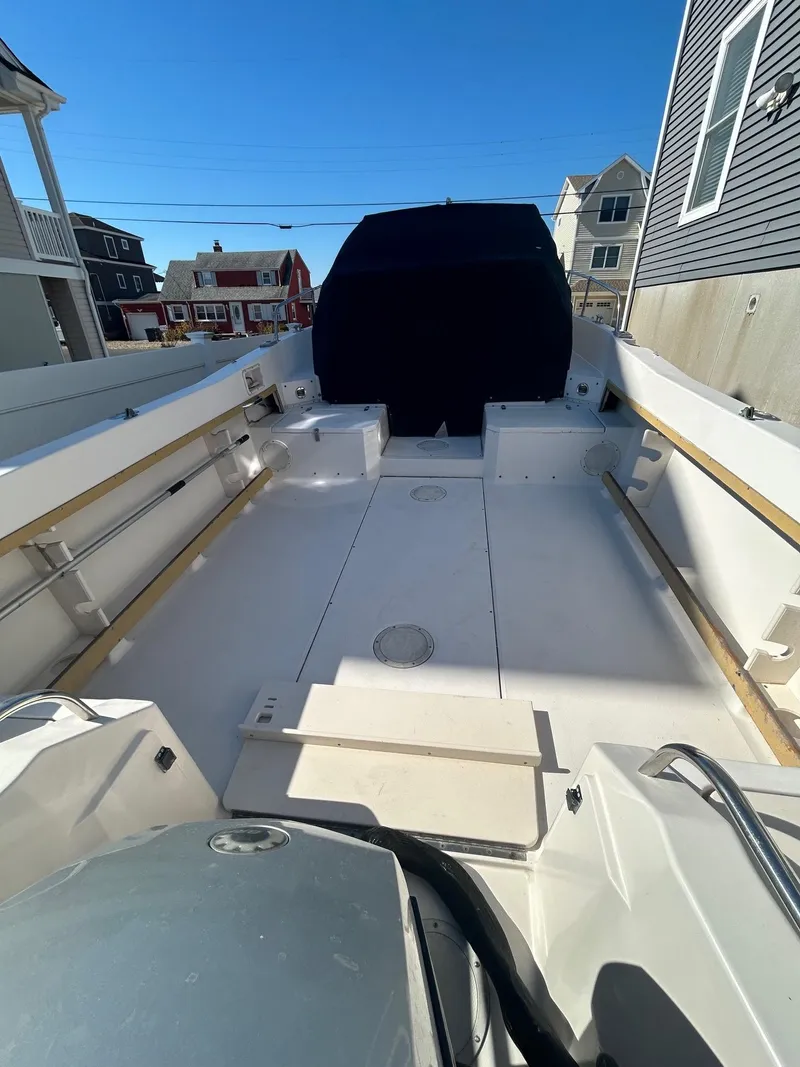 Slide: The Image of 1993 Grady-White 24 Explorer boat interior with open deck and seating. - 31