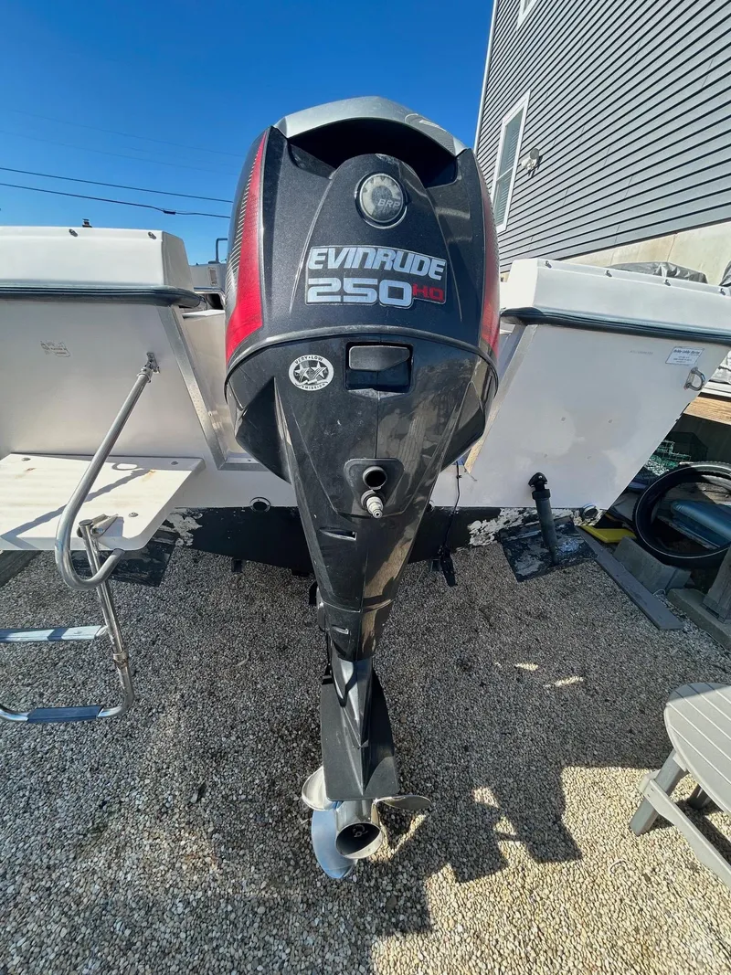 Slide: The Image of 1993 Grady-White 24 Explorer with Evinrude 250 HP outboard motor. - 33