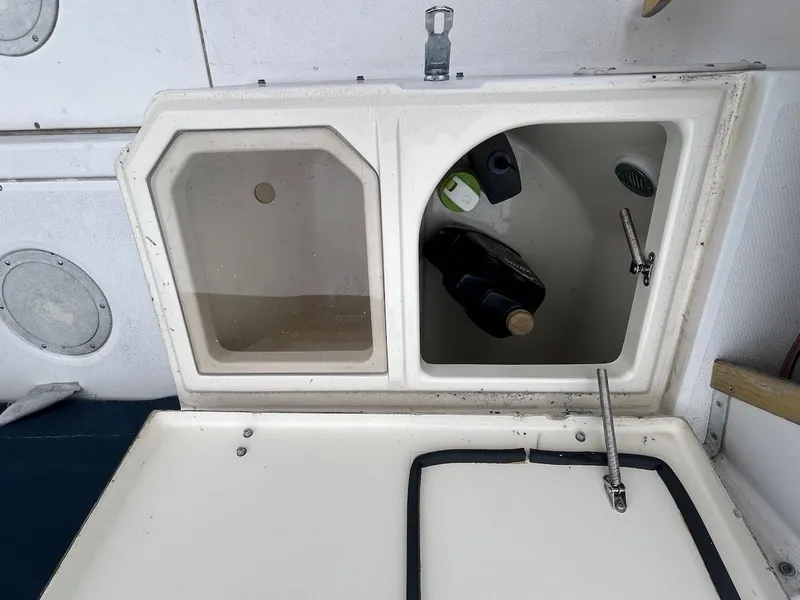 Slide: The Image of Open storage compartments on a 1993 Grady-White 24 Explorer boat. - 7